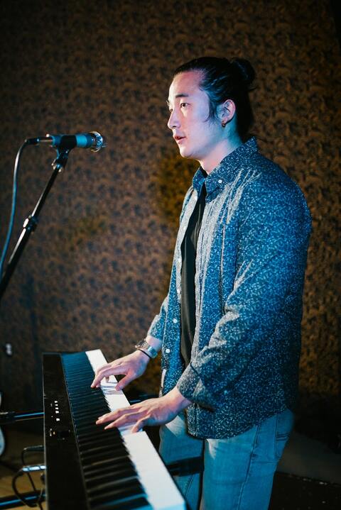 man-standing-while-playing-piano