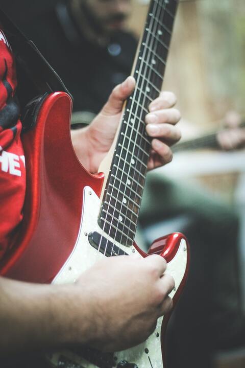 person-playing-electric-guitar